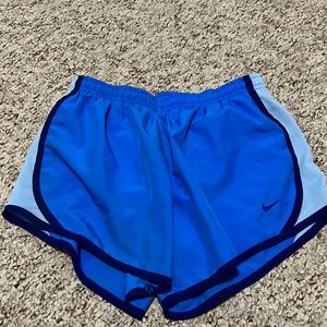 Never worn child large, fits womens xs, blue Nike athletic shorts
